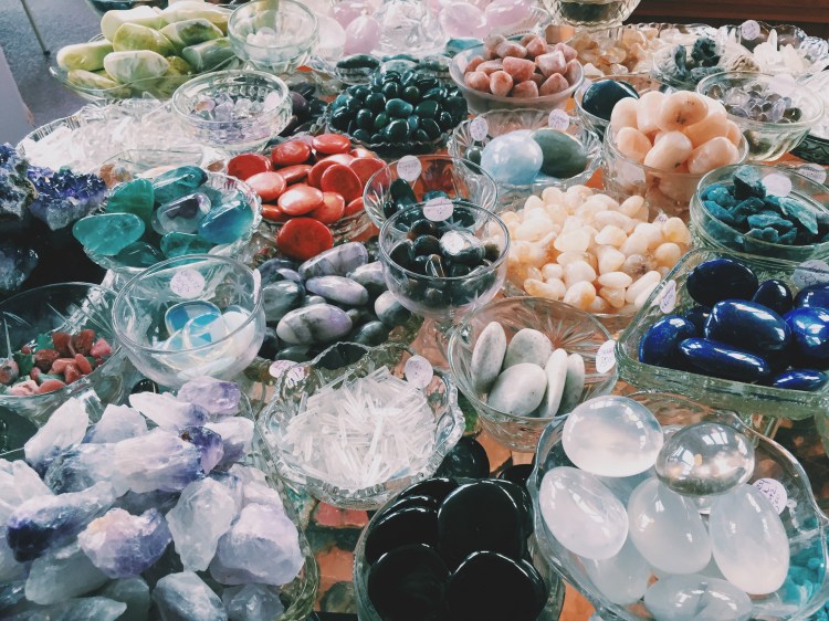 assorted gem stones in dishes