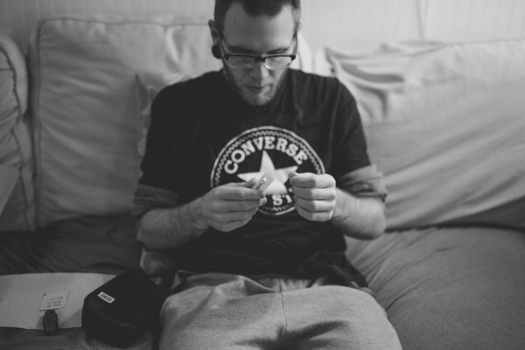 lifestyle photo of man looking at injectable medication