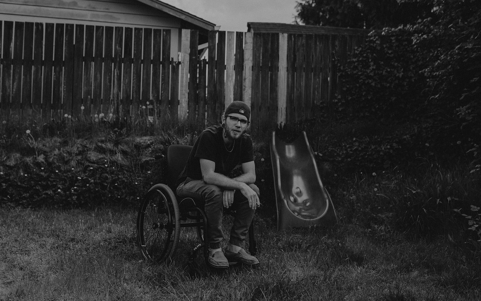 Young disabled man in wheelchair smoking cannabis in the PNW